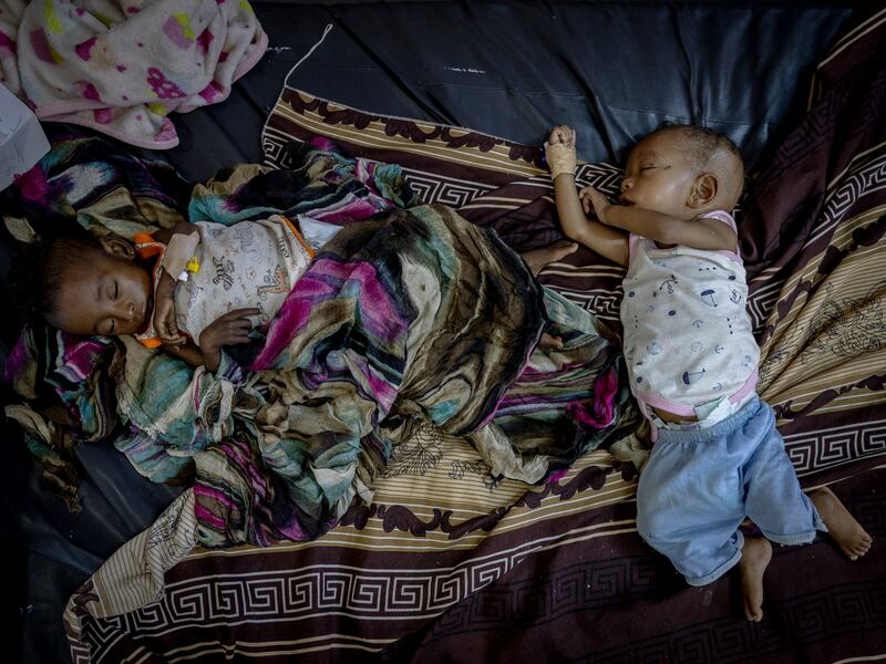 Iman and Ayman Amin, 8-month-old twins, recover at a malnutrition ward at the Albuluk Paediatric hospital in Omdurman. Photograph: Ivor Prickett/The New York Times