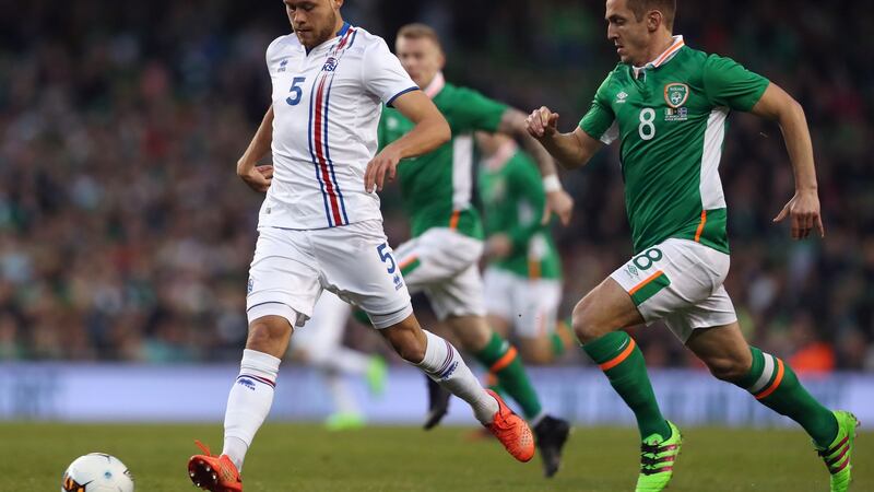 Kevin Doyle chases down Sverrir Ingason. Photo: Brian Lawless/PA