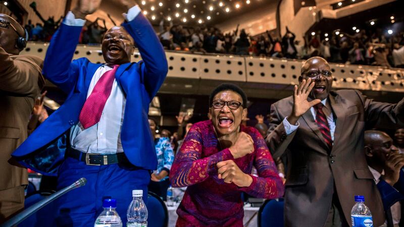 Zimbabwe’s members of parliament celebrate after Robert Mugabe’s resignation. Photograph:  AFP/Getty Images
