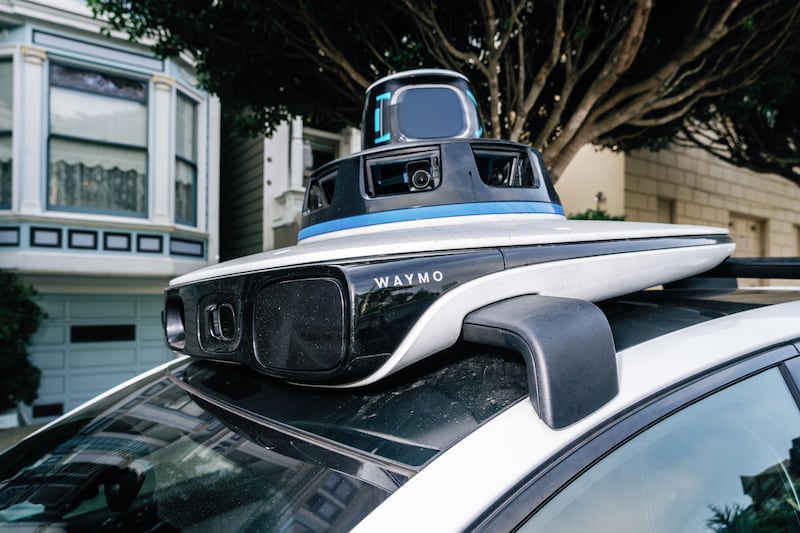 Google’s self-driving taxi arm, Waymo. Photograph: Andri Tambunan/The New York Times
                      