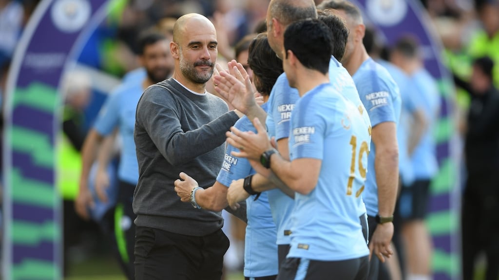 Manchester City manager Pep Guardiola celebrates winning the Premier League title following their 4-1 defeat of Brighton & Hove Albion at American Express Community Stadium. Photograph: Mike Hewitt/Getty Images