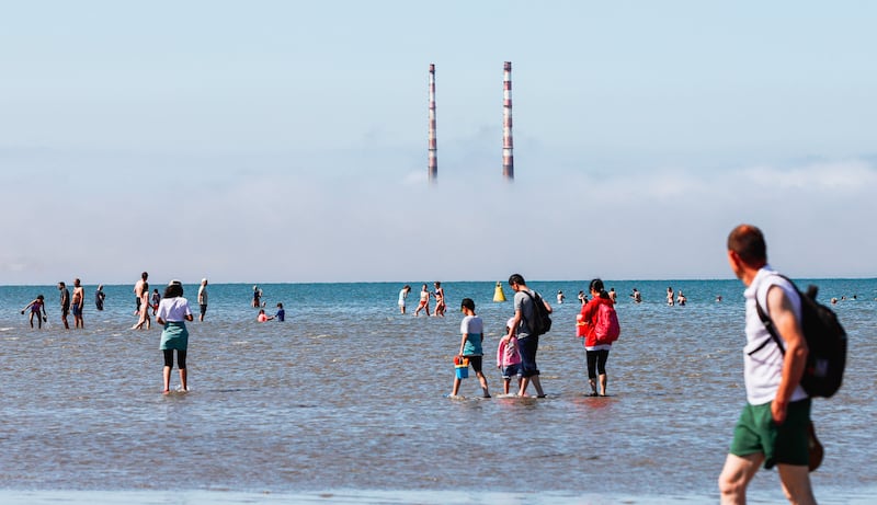 People swim in the sea during good weather at Seapoint beach in South Dublin on Sunday. Photograph: PA  