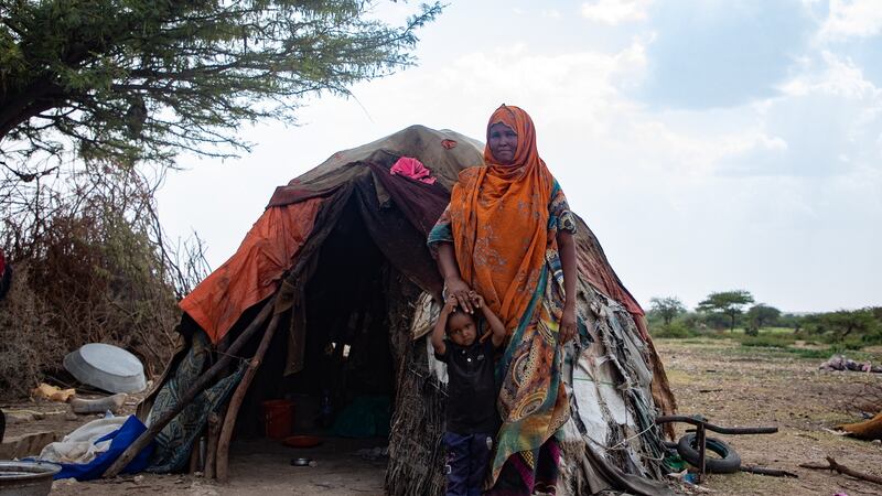 Sahra Mohamud with youngest child Omar. Sahra  used to have 250 livestock, but the  drought of 2017 killed 140 and the following cyclone killed 110. Now her family only have five  sheep and one cow. Photograph: Gavin Douglas/Concern Worldwide