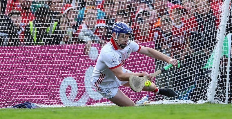 Cork's goalkeeper Patrick Collins saves a penalty to win the game. Photograph: James Crombie/Inpho