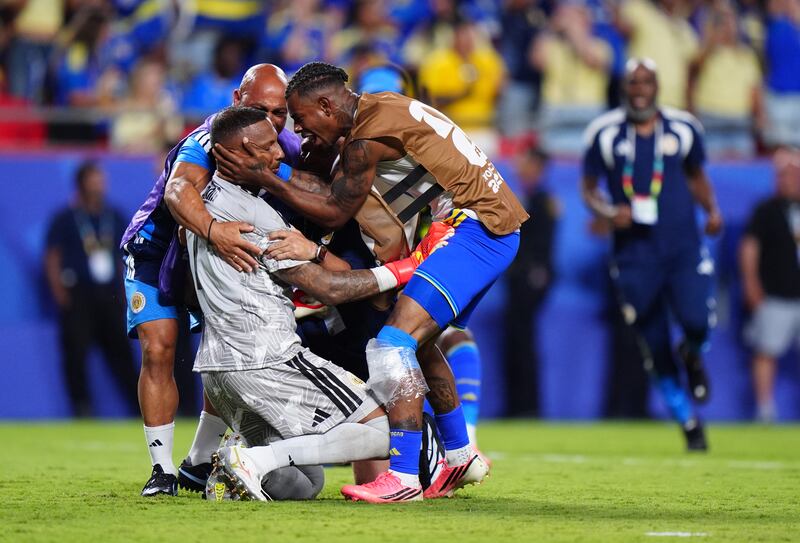 Curaçao goalkeeper Eloy Room celebrates with team mates following the Fifa World Cup Group E match at Kansas City Stadium. Photograph: Bradley Collyer/PA Wire