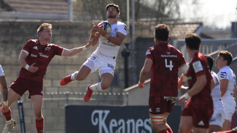 Toulouse’s Romain Ntamack leaps to claim the ball above Munster’s Mike Haley. Photograph:  Donall Farmer/PA