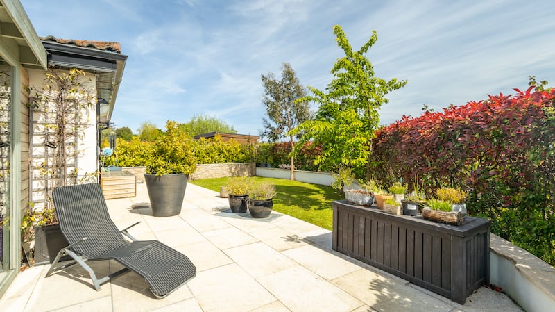 The house has side and a rear gardens