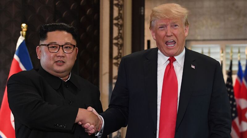 US president Donald Trump and North Korea’s leader Kim Jong Un shake hands following a signing ceremony  in Singapore in June  2018. Photograph:  Saul Loeb/Getty Images