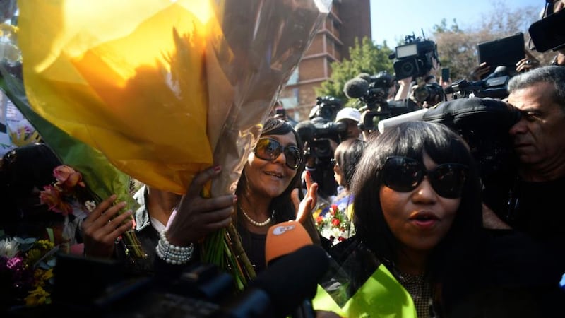 Family members of ailing former South African president Nelson Mandela make their way  through the media gathered in front of Medi-Clinic Heart Hospital  in Pretoria. Photograph: Dylan Martinez/Reuters