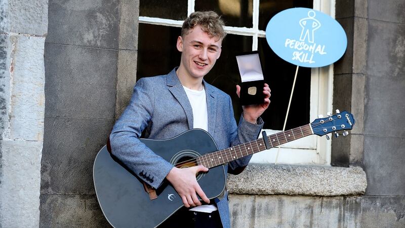 Gold Awardee Oisín Butler, Oisín improved his guitar skills as part of achieving his Gold Award in 2019. Maxwell Photography