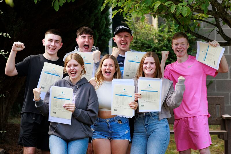 Anthony Kelly, Sophie McDonnell, Luke Kelly, Caitlin Kelly, Charlie Gigg, Saoirse Flood, and Alex Canning pose for a photo after receiving their Leaving Certificate results, at The Donahies Community School in Dublin. Photograph: Liam McBurney/PA Wire