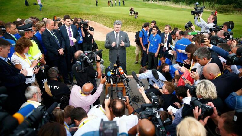 Ukraine’s president Petro Poroshenko speaks to reporters on the second and final day of the Nato summit  in Wales yesterday. Mr Poroshenko confirmed on his Twitter account that envoys meeting in Minsk to end fighting between Kiev’s forces and pro-Russian separatists had signed a ceasefire agreement. Photograph: Reuters