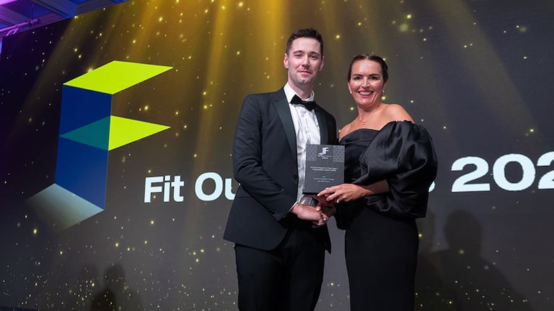 Brian Carter, procurement manager at Whiteriver Group, presents the fit out project of the year - hospitality (under €500k) award to Lynne O'Loughlin, Lynne O'Loughlin Design