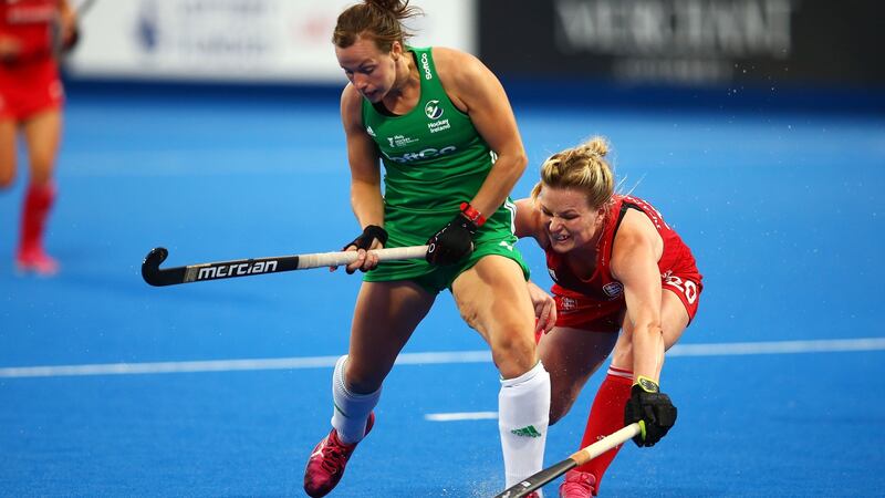 Megan Frazer of Ireland holds off the challenge of England’s  Hollie Pearne-Webb. Photograph: Jack Thomas/Getty Images