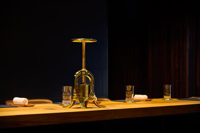 The chef's table, which features a duck press at its centre, in the restaurant's kitchen. Photograph: Barry Murphy