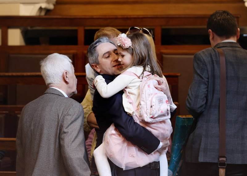 The soon-to-be Taoiseach Simon Harris  with his daughter Saoirse in the Dail Chamber. Maxwell Photography/PA Wire 


