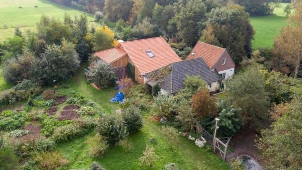 The farmhouse where a man and six young adults were found living in the cellar, in Ruinerwold in the province of Drenthe, the Netherlands. Photograph: Wilbert Bijzitter/EPA