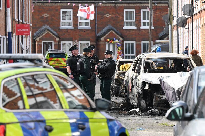 Police attend the scene as residents begin clean-up on Lendrick Street in Belfast. Photograph: Charles McQuillan/Getty Images