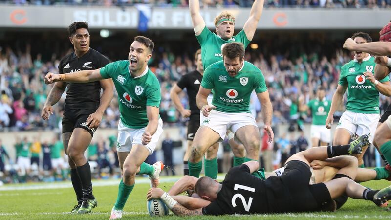 Ireland’s Conor Murray celebrates Robbie Henshaw’s try in Chicago which clinched Ireland’s first victory over New Zealand. Photograph: Billy Stickland/Inpho
