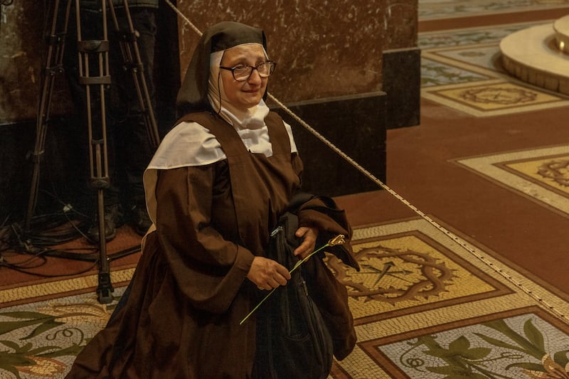 A nun sits on the floor as people gather to mourn Pope Francis at the Buenos Aires Metropolitan Cathedral in Buenos Aires, Argentina, on Monday.
Photograph: Sarah Pabst/The New York Times