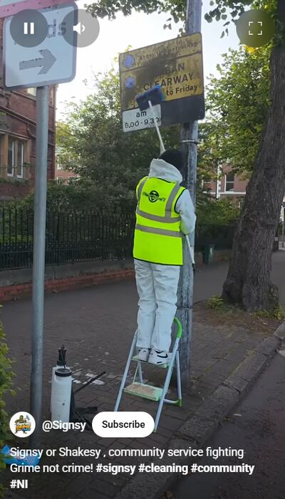 Signsy is a masked man who has taken to cleaning up graffiti and grime. Image: Signsy/ YouTube