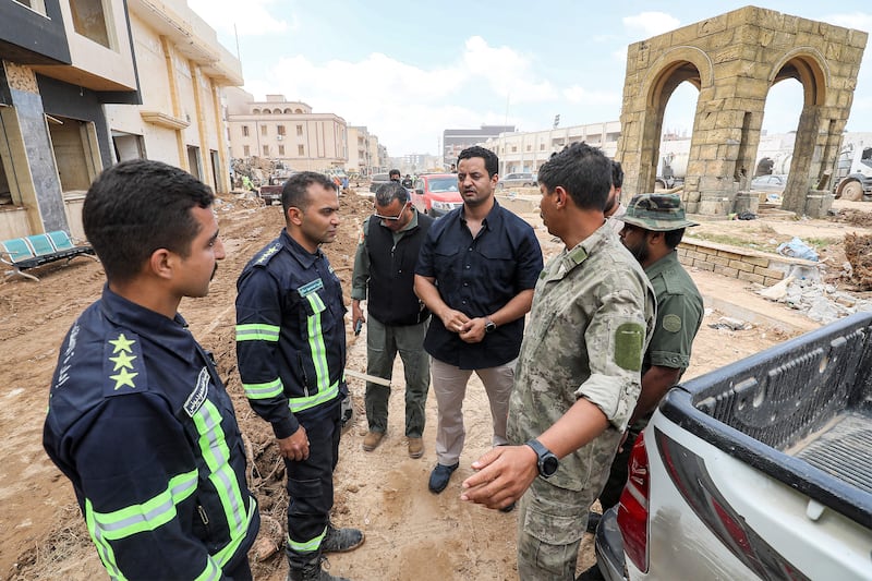 Khaled Haftar, son of Libya's eastern military leader Khalifa Haftar, meets with emergency workers in the devastated eastern city of Derna following deadly flash floods earlier this month. Photograph: Mahmud Turkia/AFP via Getty Images.