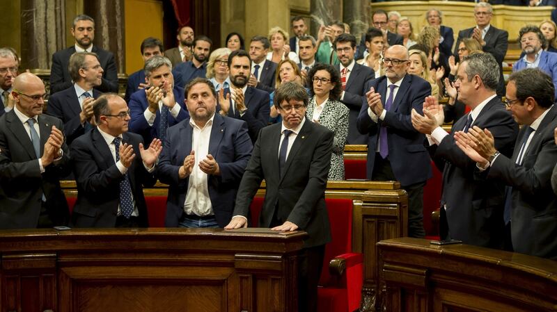 Catalan president Carles Puigdemont  is applauded after  addressing the region’s parliament in Barcelona. Photograph: Quique Garcia/EPA