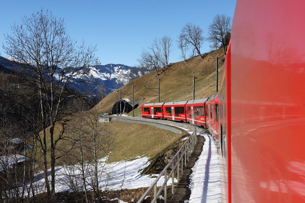 A train makes its way along railway tracks towards the town of Davos ahead of the World Economic Forum in Davos, Switzerland. Organisers have incentivised business leaders to travel by train rather than by jet. Photograph: Hollie Adams/Bloomberg