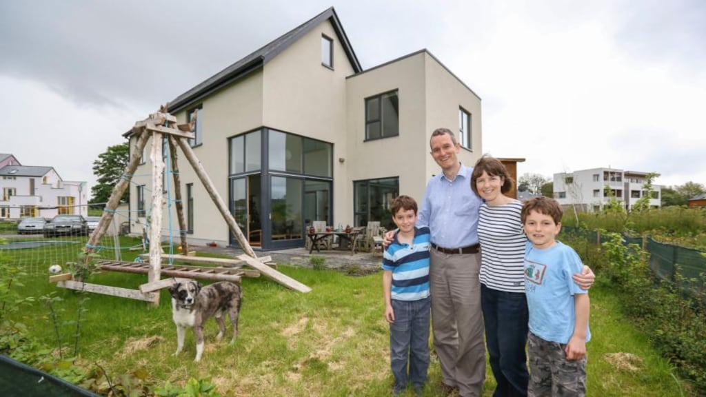 Deirdre O’Brolchain, her husband Eoin and sons Ruairí and Senan at their home in the ecovillage in Cloughjordan, Co Tipperary. Photograph: Brian Gavin/Press 22