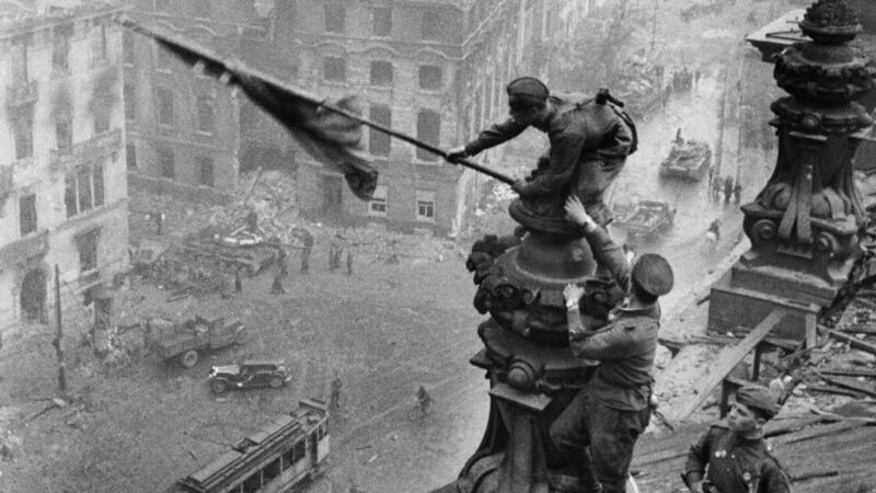 The raising of the Soviet flag over the Reichstag in Berlin, Germany, May 1945. Photograph: Sovfoto/UIG via Getty Images