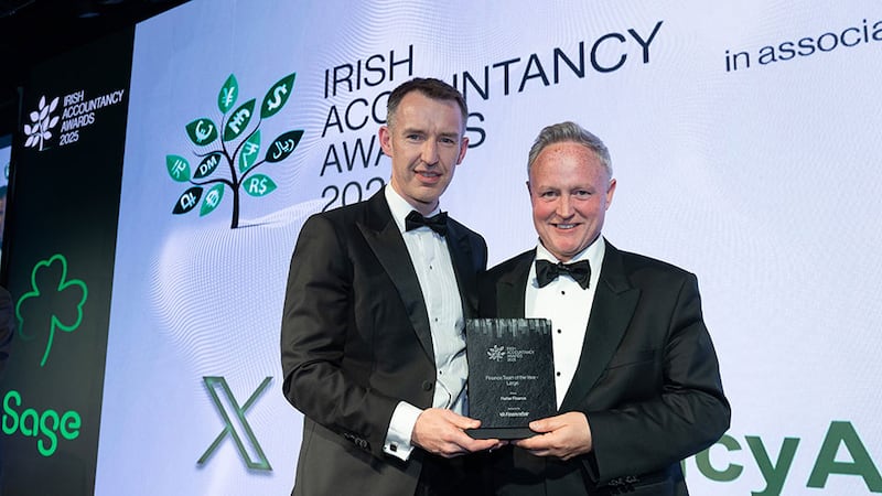 William Owens, chief financial officer, Financefair, presents the finance team of the year - large award to Mark Irwin, Flutter Finance