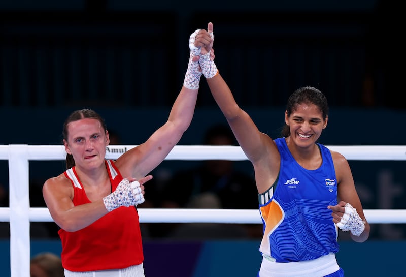 Michaela Walsh lifts Jaismine Lamboria's arm after the latter's victory in the women's 57kg final at the Commonwealth Games in Glasgow. Photograph: Francois Nel/Getty Images