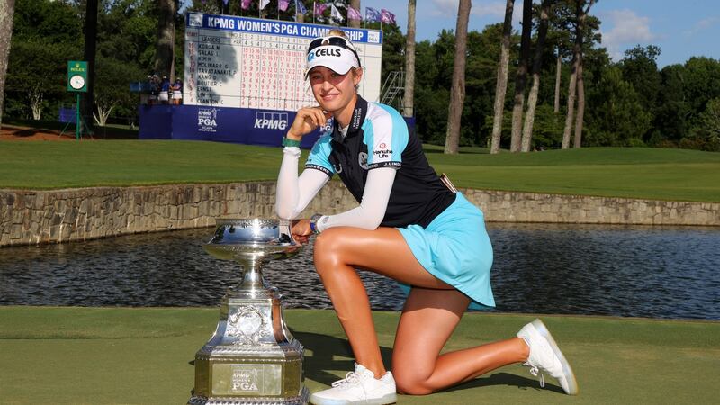 Nelly Korda poses with the trophy after her victory in the  KPMG Women’s PGA Championship. Photograph: Kevin C Cox/Getty