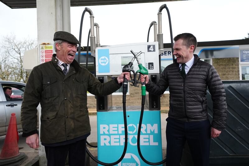 Reform UK leader Nigel Farage and Reform UK treasury spokesman Robert Jenrick at a press conference at New Haven Services in Buxton, England, on Tuesday. Photograph: Jacob King/PA Wire