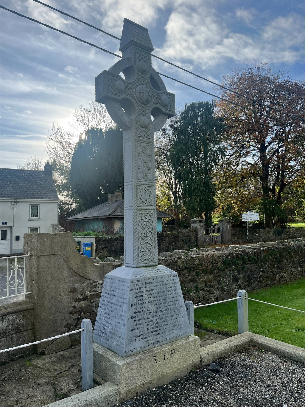A mass grave with a Celtic cross that is devoted to the memory of the victims of the Dromcollogher cinema fire disaster of 1926