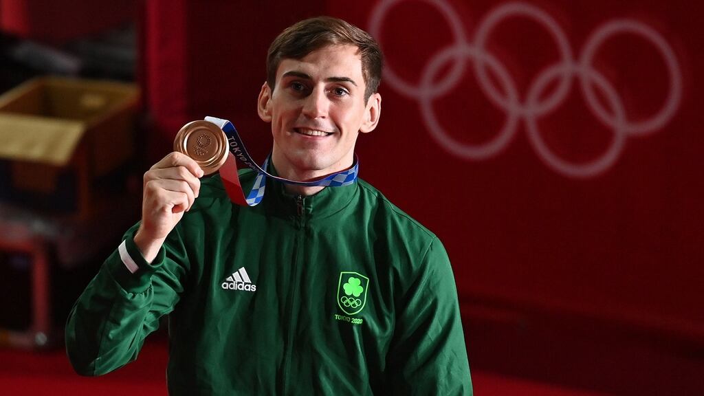 Aidan Walsh poses with his bronze medal during the victory ceremony at   Kokugikan Arena in Tokyo. Photograph: Luis Robayo/Pool/Getty Images