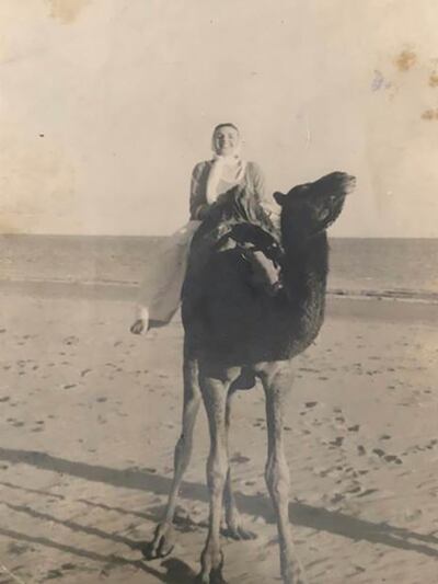 A younger Sally Teehan on a camel in Hawke’s Bay Beach, Karachi, Pakistan.