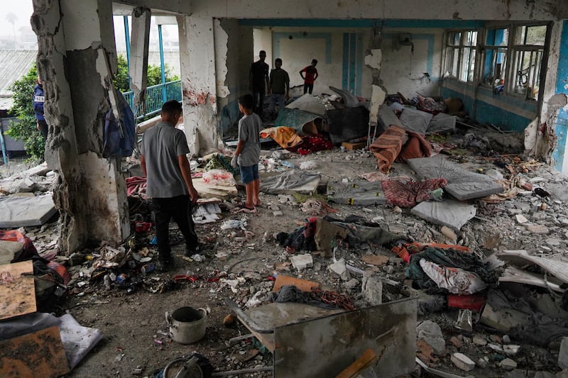 Palestinians at a UN-school that was hit during an Israeli strike in Nuseirat, in the central Gaza Strip. Photograph: BASHAR TALEB/AFP via Getty Images
