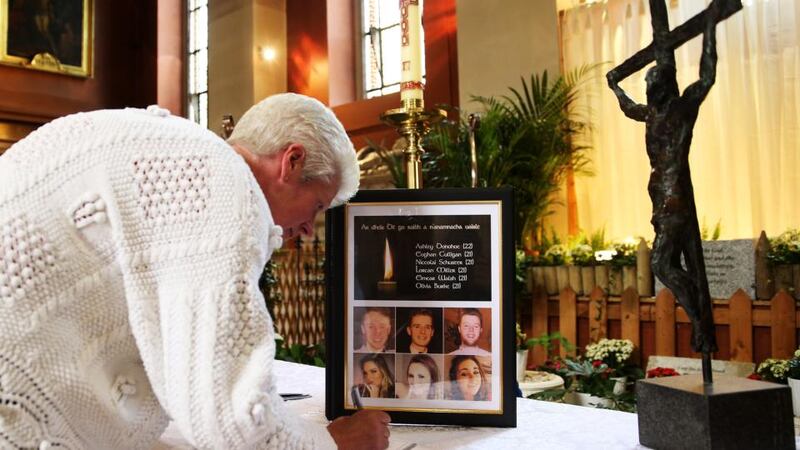 Members of the public sign a book of condolence at the Pro-Cathedral in Dublin’s city centre for those killed in the Berkeley balcony collapse. Photograph: Brian Lawless/PA Wire