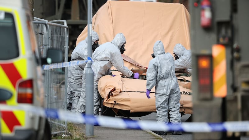 Forensic teams work at an address in Gillingham, Dorset, as they remove a recovery truck used following the Salisbury nerve agent attack. Photograph: Christopher Furlong/Getty Images