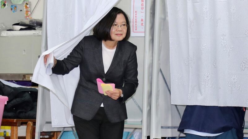 Taiwanese president  Tsai Ing-wen emerges from a voting booth at a polling station in New Taipei City during voting in the elections last weekend. Photograph: Chang Hao-an/AP