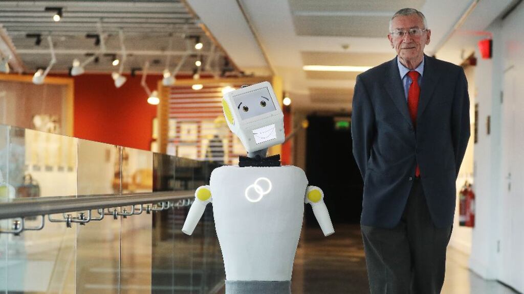 The first prototype robot designed to work in assisted care facilities, Stevie, with test user, Tony McCarthy.