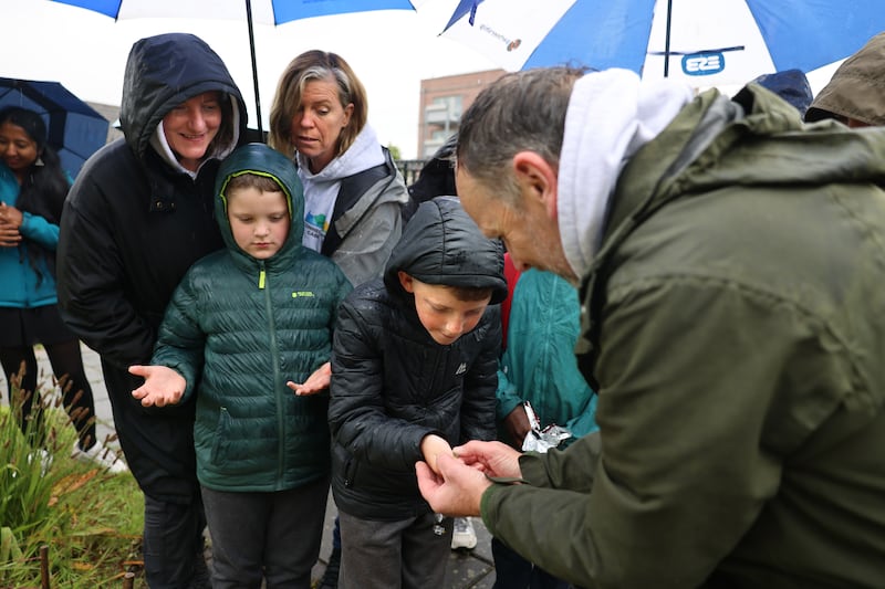 At the Starling Pond off Faussagh Avenue, Cabra are Connecting Cabra’s Stephen Shanahan (right) showing a froglet to St Finbarr's BNS students Caden Ledwidge and Carter Ledwidge with Louisa Moss, Dublin Northwest Partnership, and Michelle Nolan of Connecting Cabra. Photograph: Dara Mac Dónaill








