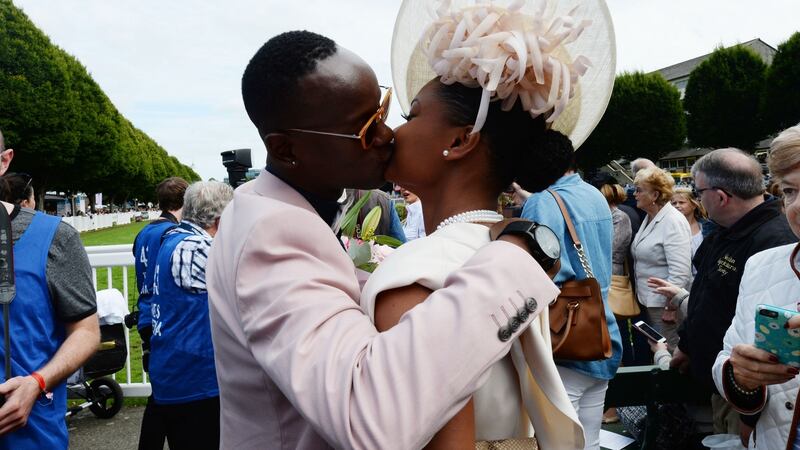 Aline Santos kisses her partner Everton Tadeu Da Silva from Brazil after he won best-dressed man at the RDS. Photograph: Alan Betson