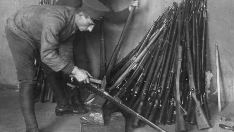 1919: German soldiers destroying rifles in accordance with the requirement for Germany to disarm, as laid down by the Treaty of Versailles. Photograph:  Three Lions/Getty Images