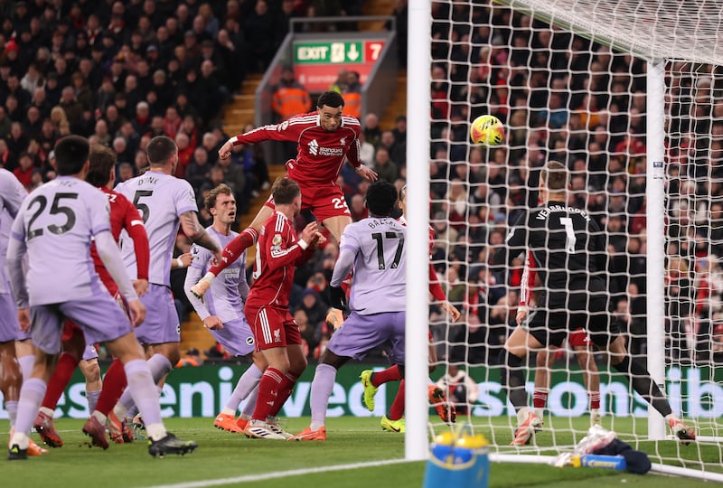 Liverpool striker Hugo Ekitiké heads home his second goal against Brighton at Anfield. Photograph: Carl Recine/Getty Images