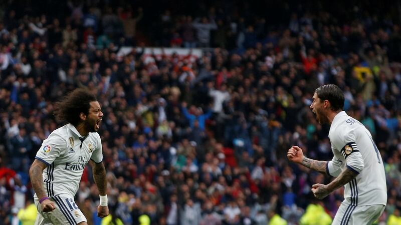 Real Madrid’s Marcelo celebrates scoring with team-mate Sergio Ramos in the La Liga game against   Valencia at the  Santiago Bernabeu Stadium. Photograph: Susana Vera/Reuters