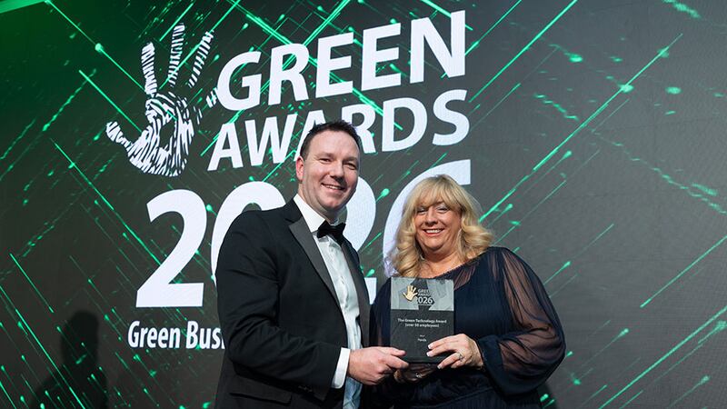 Padraig Ryan, awards judging coordinator, presents the green technology award (over 50 employees) to Jo Cooper, Panda