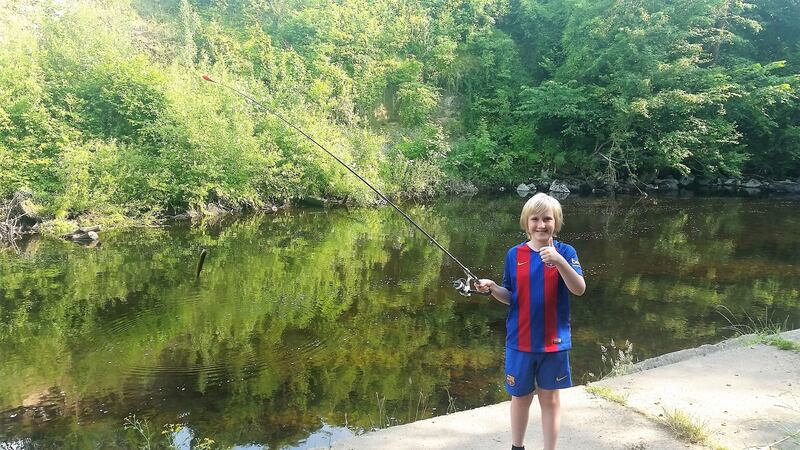 Fionn Evans with his first trout while fishing the River Flesk in Killarney, Co Kerry. (Taking after his grandfather, no doubt!)