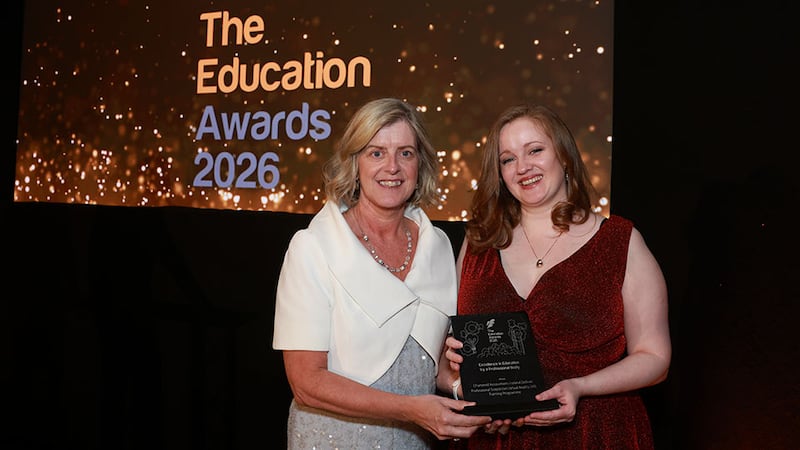 Mary Kelly, awards judge, presents the excellence in education by a professional body award to Aisling Mooney, Chartered Accountants Ireland Skillnet